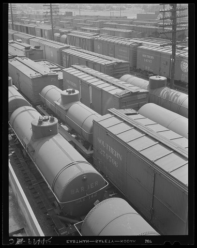 Untitled photo, possibly related to: Chattanooga, Tennessee. Freight cars and oil tanks in the railroad yards