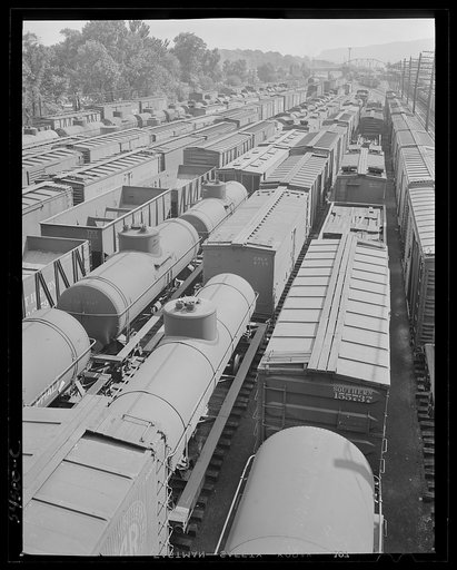 Untitled photo, possibly related to: Chattanooga, Tennessee. Freight cars and oil tanks in the railroad yards