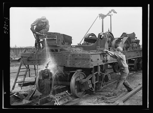 Boston and Maine railroad shops at Billerica, Massachusetts. Dismantling a railroad wrecking crane