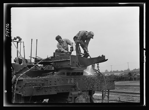 Boston and Maine railroad shops at Billerica, Massachusetts. Dismantling a railroad wrecking crane