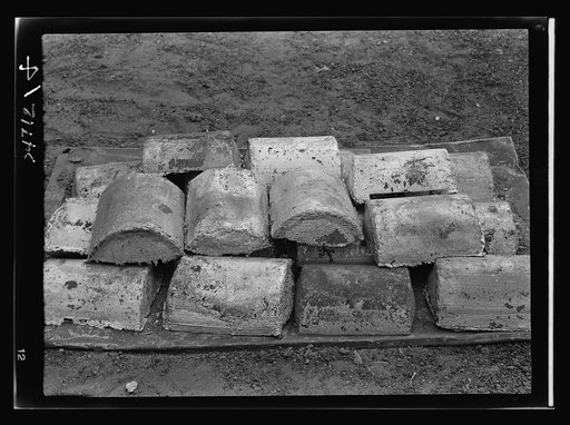 Boston and Maine railroad shops at Billerica, Massachusetts. Almost a ton of lead in this small pile will be used over and over again. This lead was taken out of the locomotive drives wheels (see negative 1 [i.e 54699]) and is used to give wheel flywheel effect
