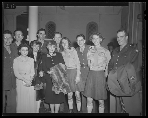 Washington, D.C. Mrs. Stuart Godfrey, chairman of music for the services, and members of the cast of the Bolling Field show after their performance at the kitchen shower of the Walsh Club for war workers. Left to right: Corporal Virgil Fox, noted organist and pianist; Corporal Don Benjamin, director