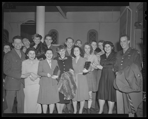 Washington, D.C. Enlisted personnel Bolling Field after their performance at the kitchen shower of the Walsh Club for war workers with members of the club and Mrs. Stuart Godfrey, chairman of music for the services. Left to right: Corporal Virgil Fox, noted organist and pianist; Corporal Don Benjami