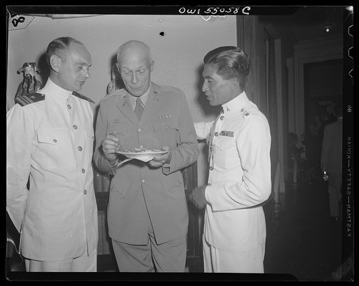 Washington, D.C. Present at an informal reception at the Thai Legation in celebration of the nineteenth birthday of King Ananda of Thailand, who is currently residing in Switzerland, were, left to right, Lieutenant Commander Edmond L. Taylor, United States Navy, who has recently returned from Far Ea