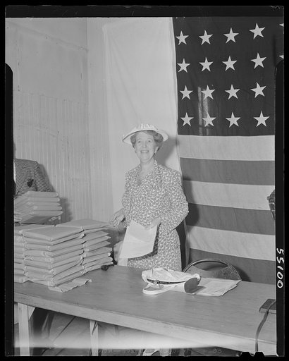 New York (and vicinity), New York. Miscellaneous photograph relating to the war effort. Woman volunteer who checks and posts ceiling prices for the U.S. Office of Price Administration (OPA)