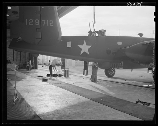 Kansas City, Kansas. Workmen assembling parts of a plane at the North American Aviation Inc. plant