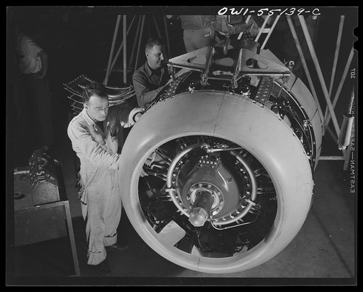 Kansas City, Kansas. Employees working on a motor assembly of a B-25 bomber at North American Aviation, Inc.