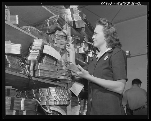 A clerk in the hydropress department checks parts as they come into the department