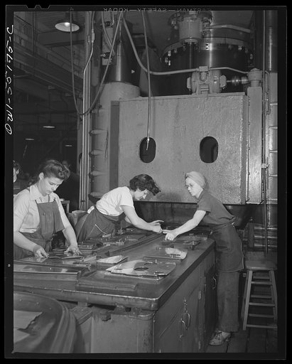 When sheet metal parts are cut on the router, they go to the hydropress department where they are placed on masonite dies and pressed to the proper shape