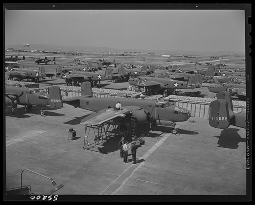 A partial view of the outside assembly line at North American Aviation. Ideal weather allows California factories to work outdoors. This is called the "Sunshine Assembly Line"'