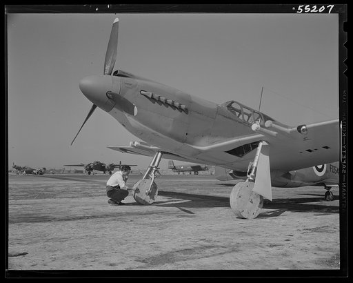 Wood wheels are placed on fighters as they move down the assembly line and onto the flight ramp. When the ships are ready for flight, rubber wheels are attached, and the wood goes back to the assembly line