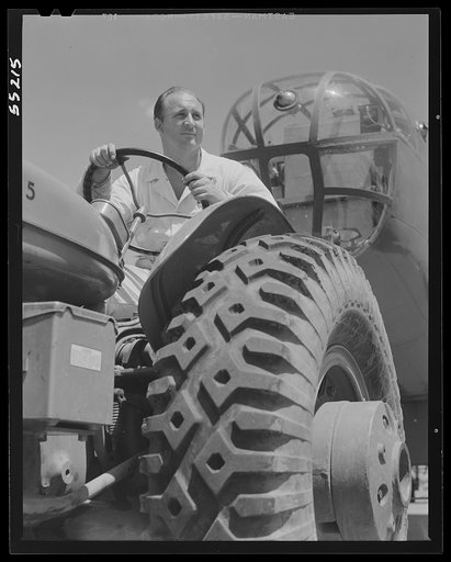 Kansas City, Kansas. Hauling a B-25 bomber with a tractor at North American Aviation, Inc.