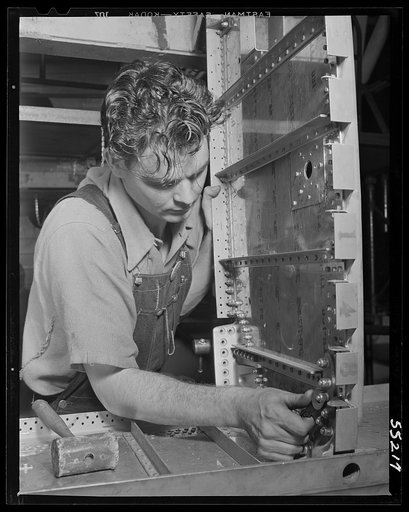Kansas City, Kansas. A man doing skin sub-assembly work at North American Aviation, Inc.