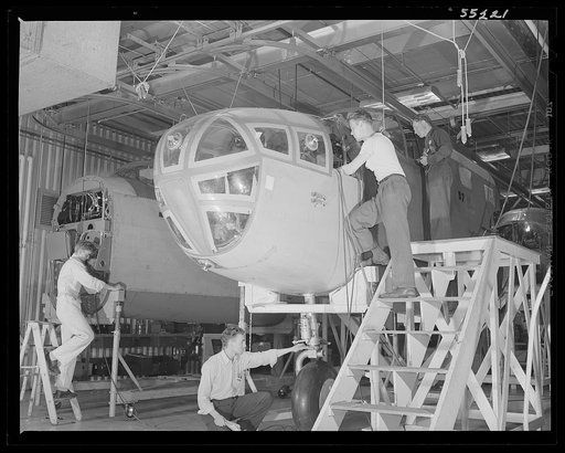 Kansas City, Kansas. Men working on the nose section of a plane on the assembly line at North American Aviation, Inc.
