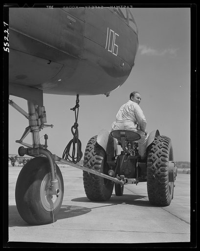 Kansas City, Kansas. A B-25 bomber being hauled on the outdoor assembly line at North American Aviation, Inc.