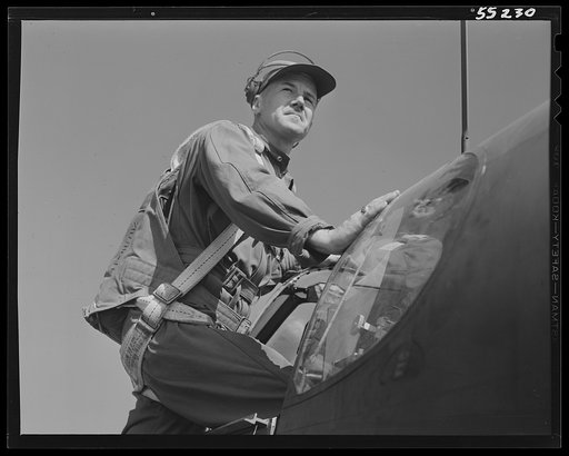 Captain B.R. Eckstein, Army Air Force's representative at North American climbs into a P-51 Mustang fighter for a final test before acceptance by the Army Air Force