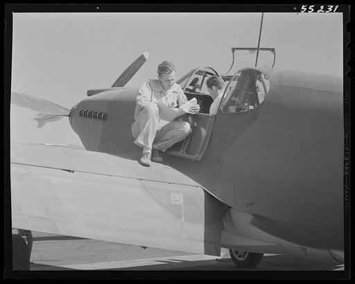 Before making its first flight, North American P-51 fighters are checked over by the company flight test crew