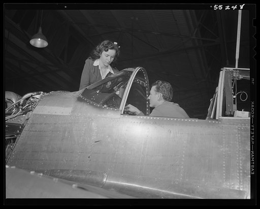As in the sub-assembly departments, men and women work together in the final assembly of North American P-51 Mustang fighters