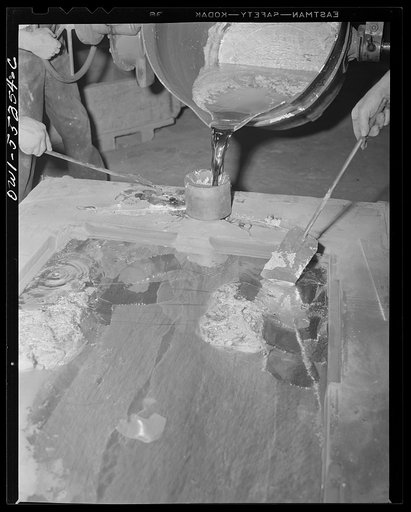 In North American's foundry, kirksite is poured into a mould