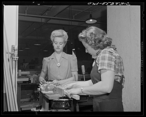 These two women employees in North American's wood shop run a planer