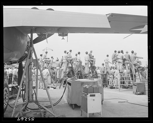 North American employees gather on the flight ramp during lunch period to see the ships they helped build perform