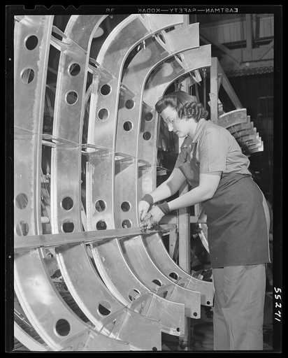 A woman employee assembles a B-25 tank on a jig at North American Aviation