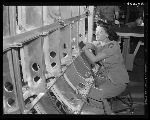 One of North American Aviation's many women employees assembles a B-25 tank structure