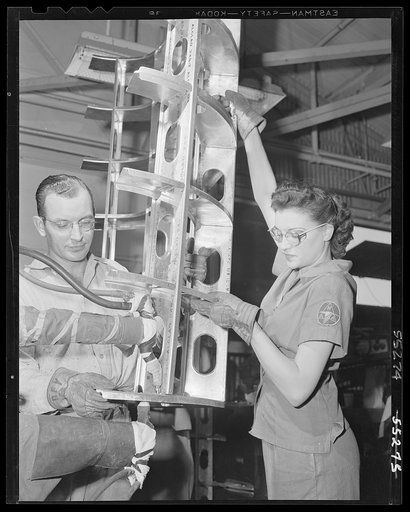 Electric spotwelding is becoming increasingly important in the aviation industry. Two North American employees work together on a tank that will go into a B-25 bomber