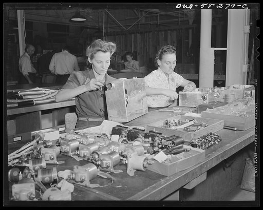 In the electrical assembly department, women employees assemble switch boxes for North American B-25 bombers