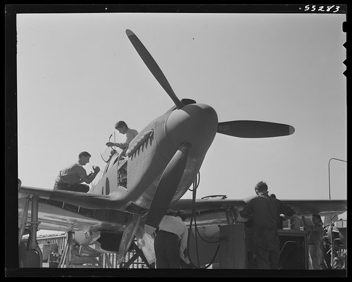 North American Aviation's P-51 Mustang fighter receives its finishing touches outdoors on the "California Assembly Line"