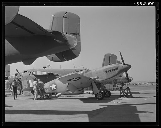B-25 bombers and P-51 fighters stand side by side on North American's flight ramp