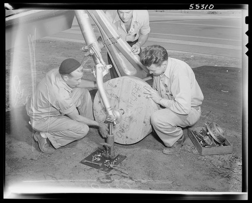 Because of the rubber shortage, many planes roll along assembly lines and onto the flight ramp on wooden wheels
