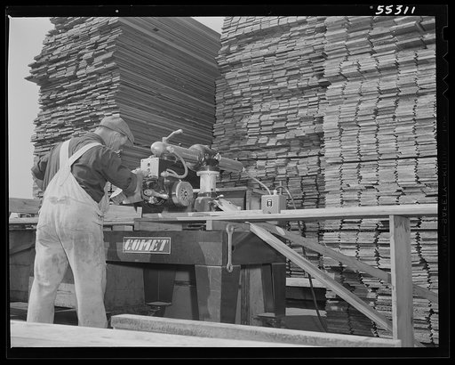 Wood is cut to the exact shape for assembling crates for shipping supplies and spare parts from North American's shipping department