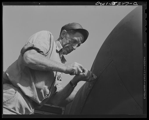 A skilled employee at North American assembles the cowling on a North American B-25 bomber