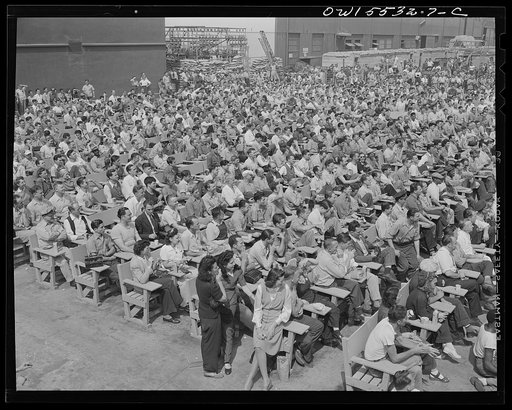 Thousands of North American employees gather at the recreation center during lunch period to witness a variety of programs