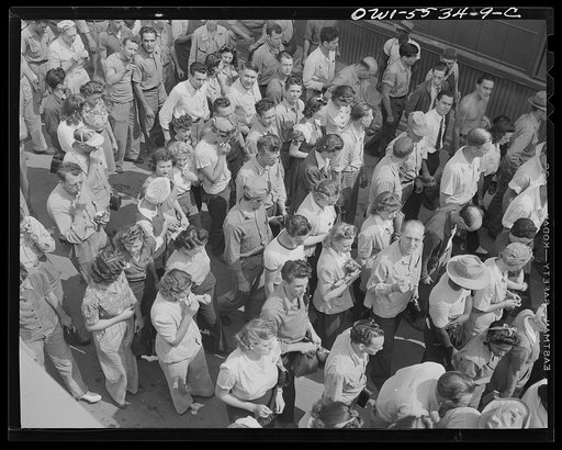 Inglewood, California. Employees of North American Aviation, Inc., listening to an outdoor program while eating their lunch