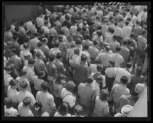 Inglewood, California. Employees at North American Aviation, Inc., returning to their work after lunch