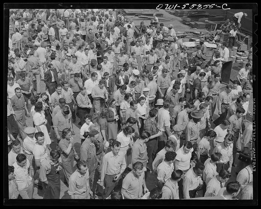 Inglewood, California. Employees of North American Aviation, Inc., returning to their work at indoor and outdoor assembly plants after lunch