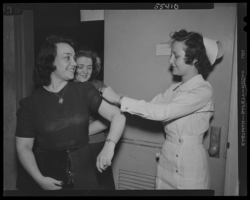 U.S. Office of War Information (OWI) employees receiving free inoculation against smallpox, diptheria and typhoid