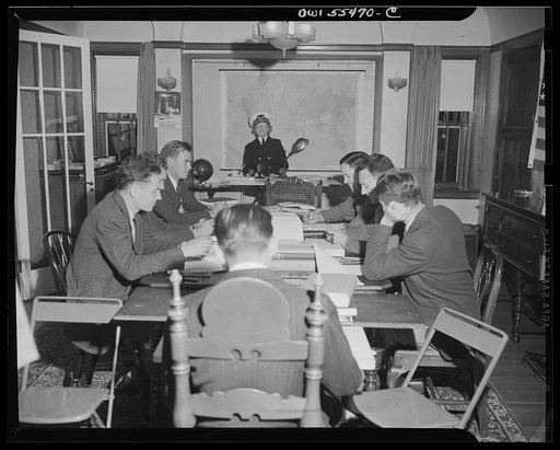"Captain" Mary Converse, instructing V-7 (candidates for United States Navy ensign commissions) students in use of sextant, compass and gyroscope and in navigation. Classes are held in dining room