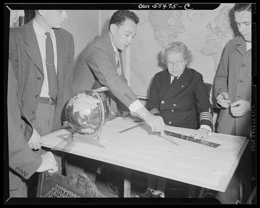 "Captain" Mary Converse, instructing V-7 (candidates for United States Navy ensign commissions) students in use of sextant, compass and gyroscope and in navigation. Classes are held in dining room