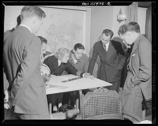 "Captain" Mary Converse, instructing V-7 (candidates for United States Navy ensign commissions) students in use of sextant, compass and gyroscope and in navigation. Classes are held in dining room