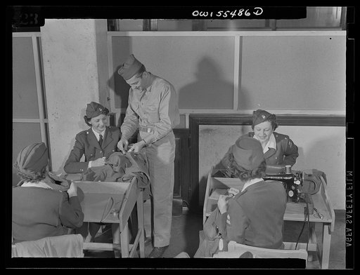 Untitled photo, possibly related to: Catching that stitch in time, the American Women's Volunteer Service unit at Glendale, California. Members of the American Women's Volunteer Service "Button Brigade" meet at least twice weekly at the Army Air Force barracks in Glendale to do minor tailor work
