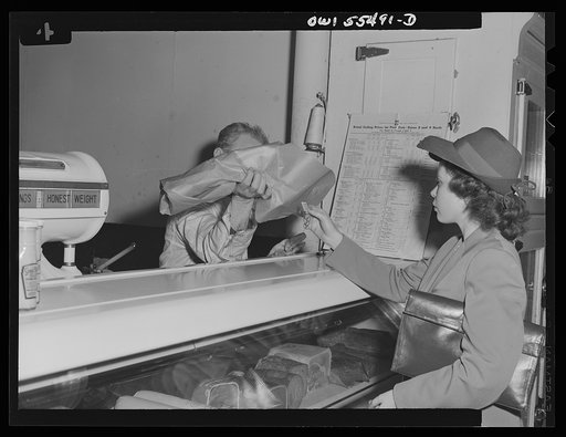 Slaughtering for the "black market" in meat. Shopper accepting a ration point bargain(?) piece of meat