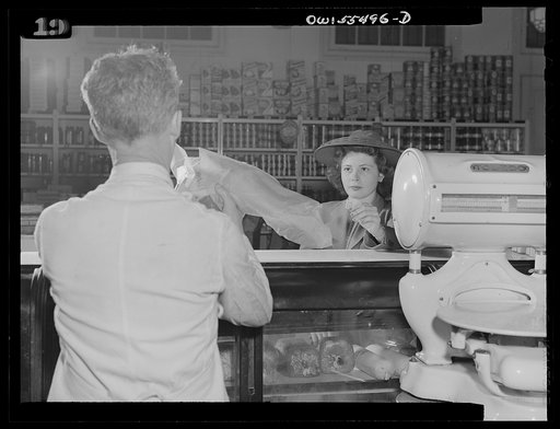 Slaughtering for the "black market" in meat. Shopper accepting a ration point bargain(?) piece of meat
