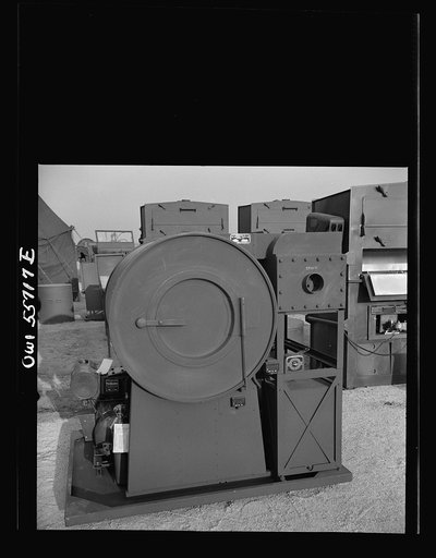 Laundry unit for small detachments. Weights 2,465 pounds, will clean and dry 40 pounds of laundry per hour and will serve up to 600 men. Shown at demonstration held by United States Army Air Forces