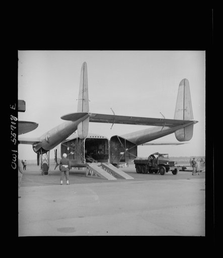 Rear view showing how after end of fuselage opens to the complete height and width of the interior, which is square. This newest transport of the United States Army Air Forces is in the 50,000 pound class, and in its weight and bulk carrying capacity it will enable the air transport of ninety percen