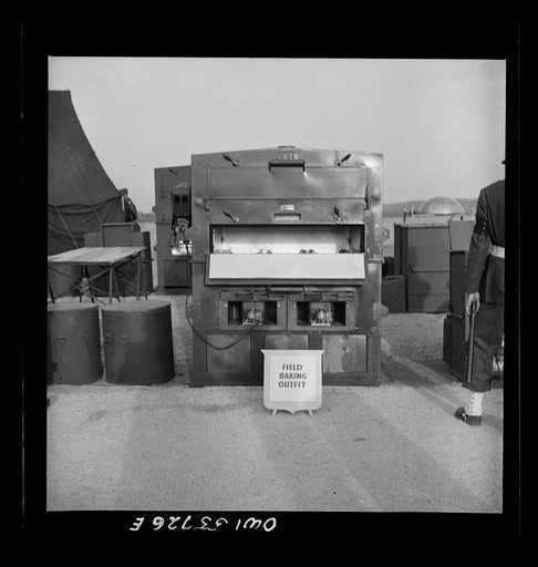 Field baking outfit. A unit developed by the Quartermaster Corps, Army Service Forces. In line with the increasing importance of airborne operations, lighter materials have gone into quartermaster equipment in recent months. Shown in demonstrations of equipment held by United States Army Air Forces