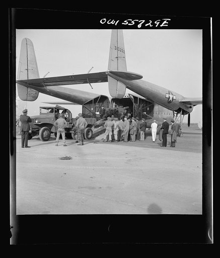 United States Army Air Forces newest transport and most promising for airborne operations. Its specific function is to land heavy military loads safely on rough fields near battle points. First war plane designed solely for hauling military cargo. May be used to carry troops, paratroops,  and equipm