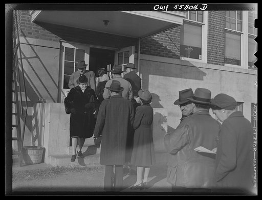 Arlington, Virginia. Two voters leaving Wilson High School while others wait in line to enter to cast their ballots in the national presidental election
